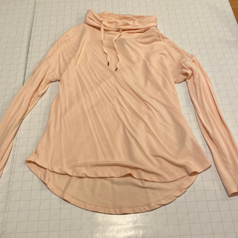 Blush pink long-sleeve, bunchy neckline (not a hood)